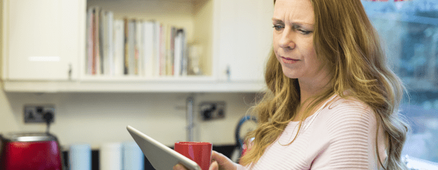 Woman looking at tablet screen