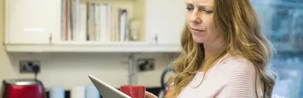 Woman looking at tablet screen